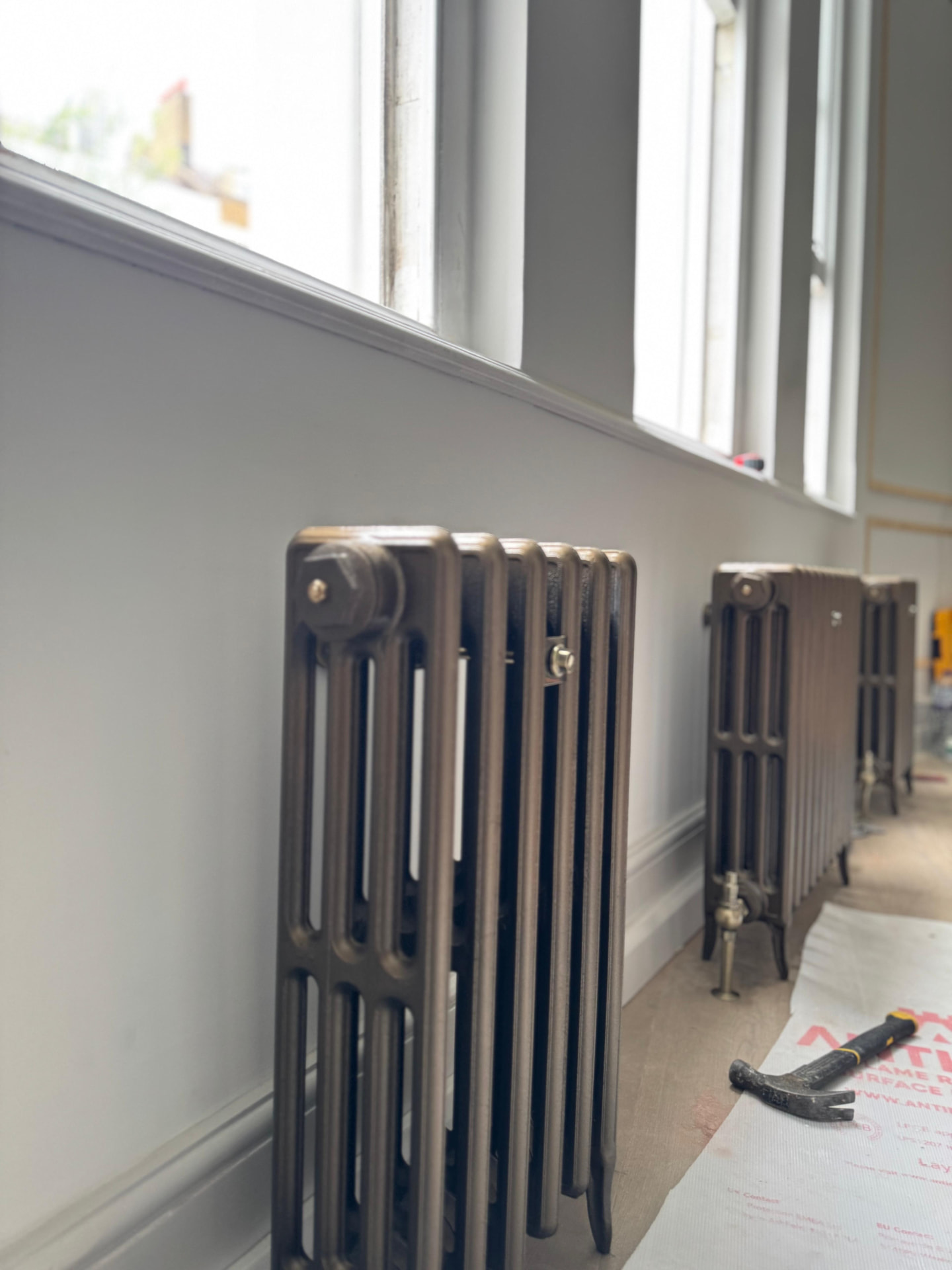 Restored cast iron column radiators fitted in a period property